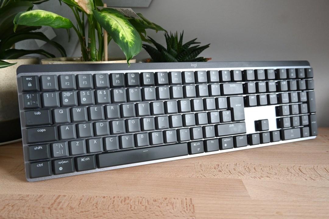 Stuff review Logitech MX Mechanical three-quarters angle next to plants