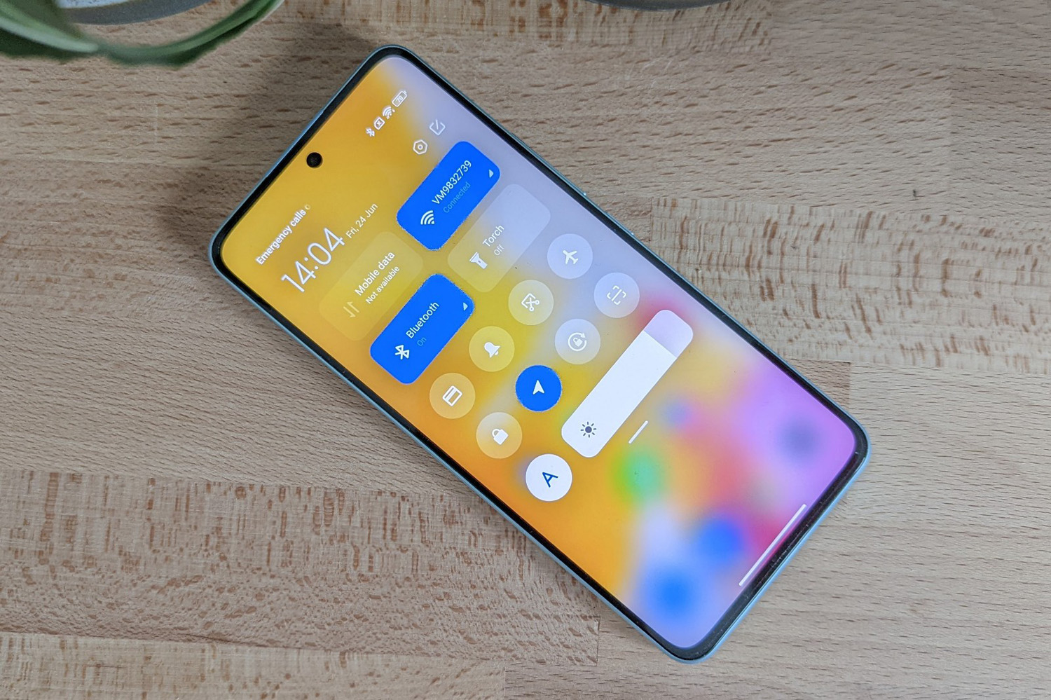 Stuff Xiaomi 12 Lite smartphone review notification tray on wood table